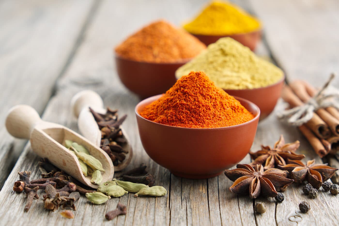 Aromatic spices and herbs: red pepper, turmeric, cardamom, cinna